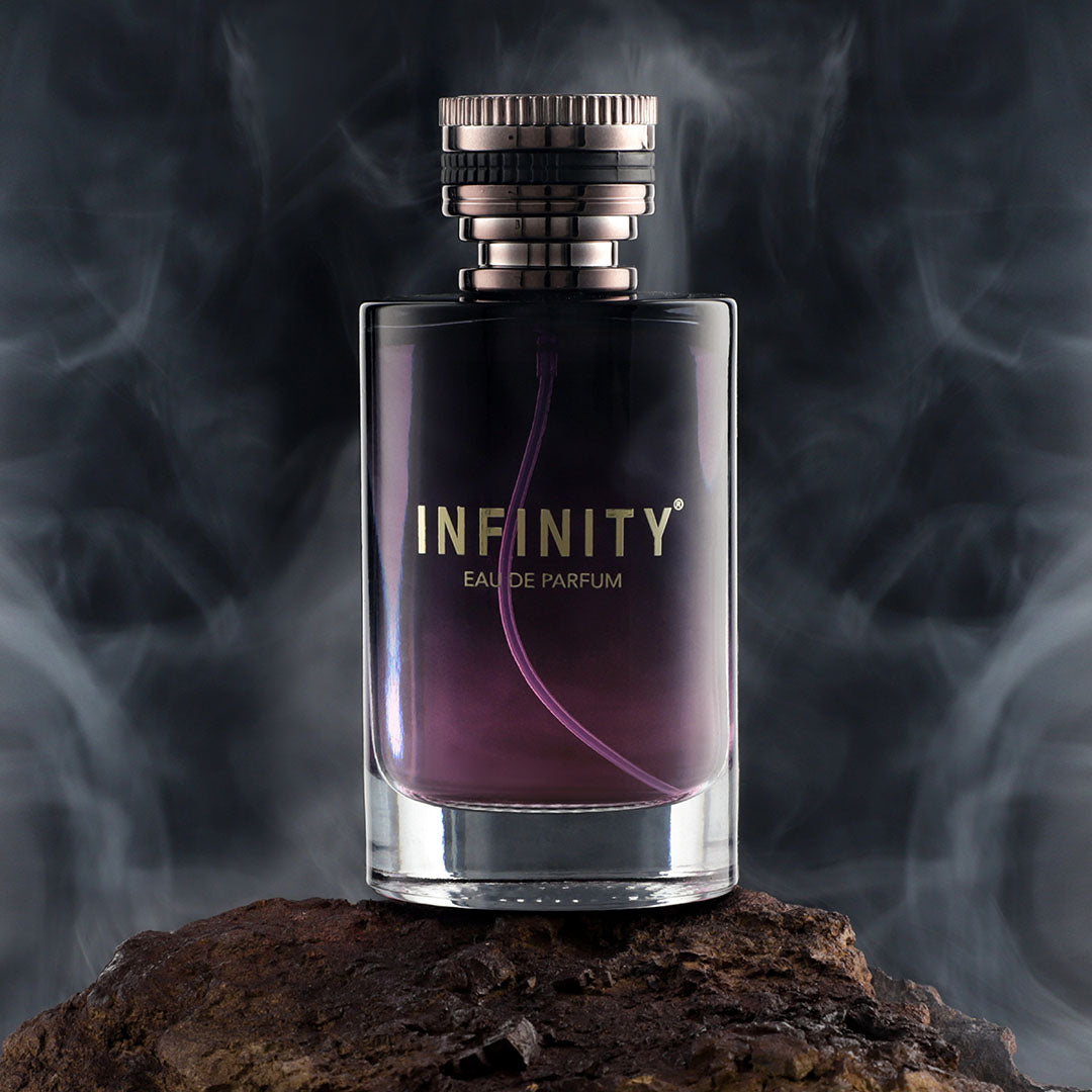 infinity-wisper-eau-de-perfume-100ml-bottle-on-rock-with-smokey-background